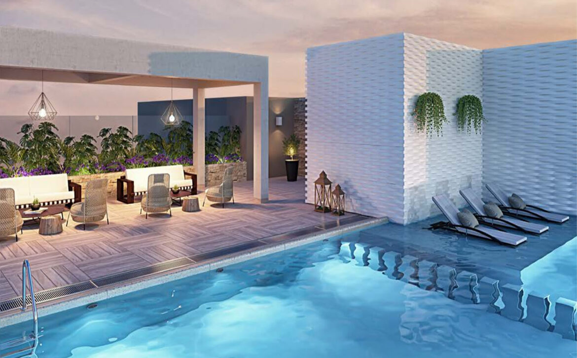 Terraza con piscina y zona de descanso del edificio, departamento en venta en Lince